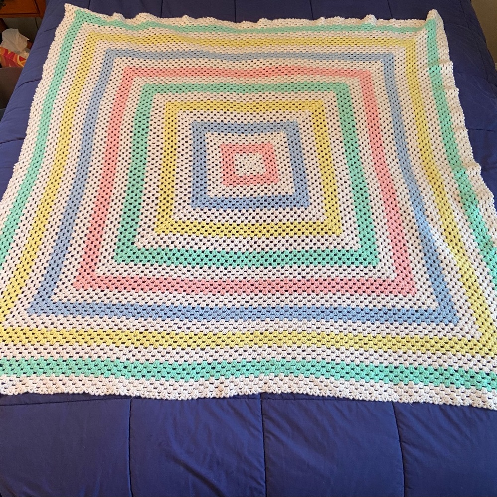 Pink blue green yellow square crochet blanket